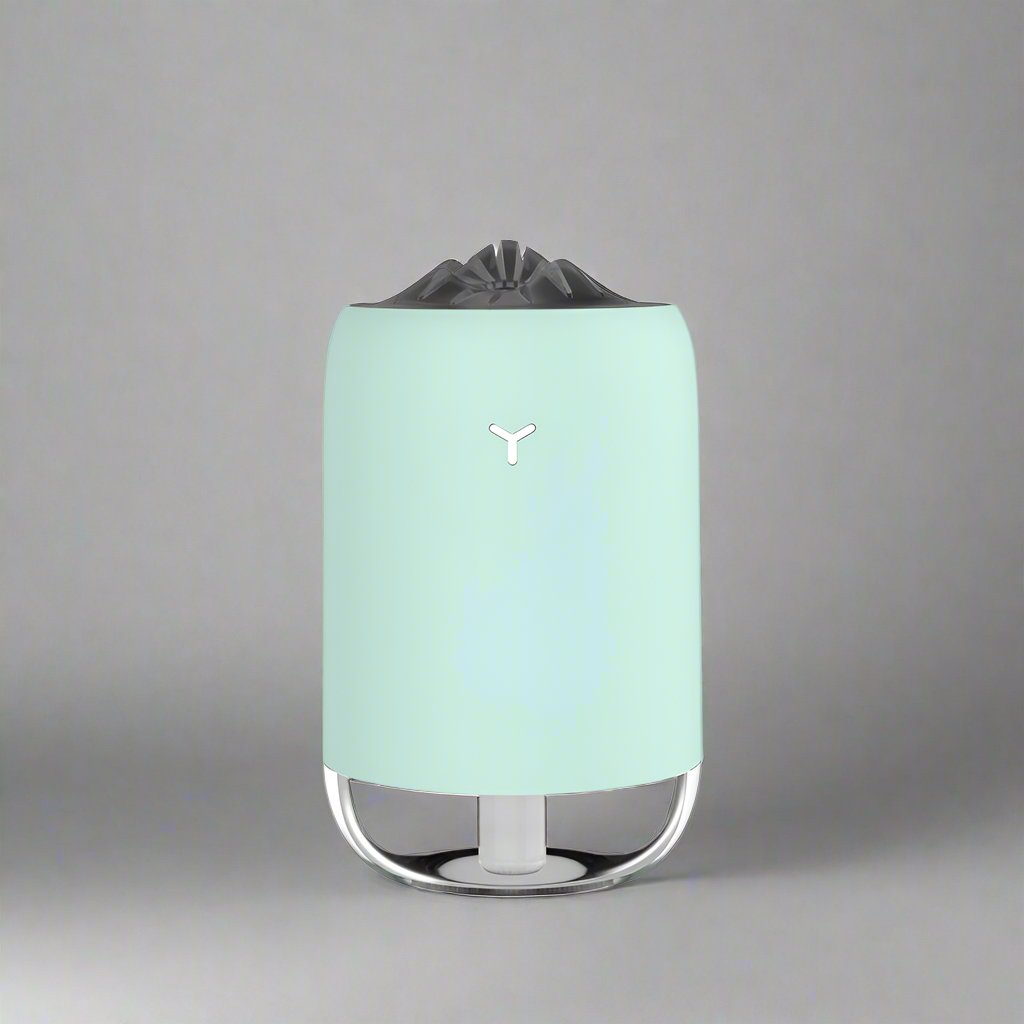 Mint green Magic Flame Aroma Diffuser Humidifier with a sleek design and LED lighting feature, suitable for desktop and car use. Ideal for home, office, and travel settings."
