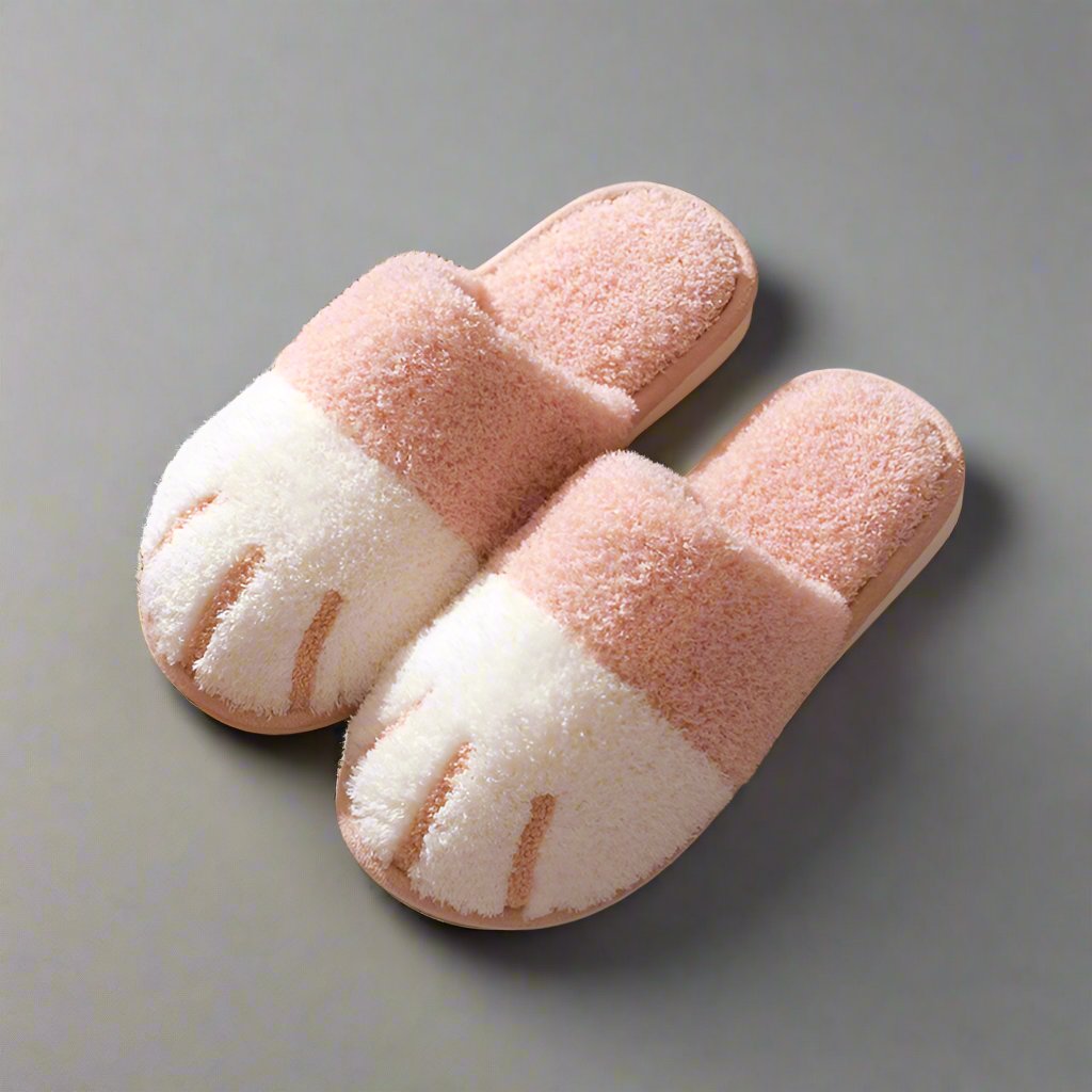 Pink and white fluffy paw-shaped slippers for autumn and winter, designed for women. Cozy indoor floor shoes ideal for bedrooms, featuring a kawaii style. Suitable for couples, these warm flat footwear slides add comfort and style to any home setting.